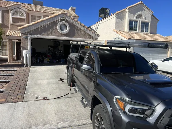 New residential garage door with truck in the driveway
