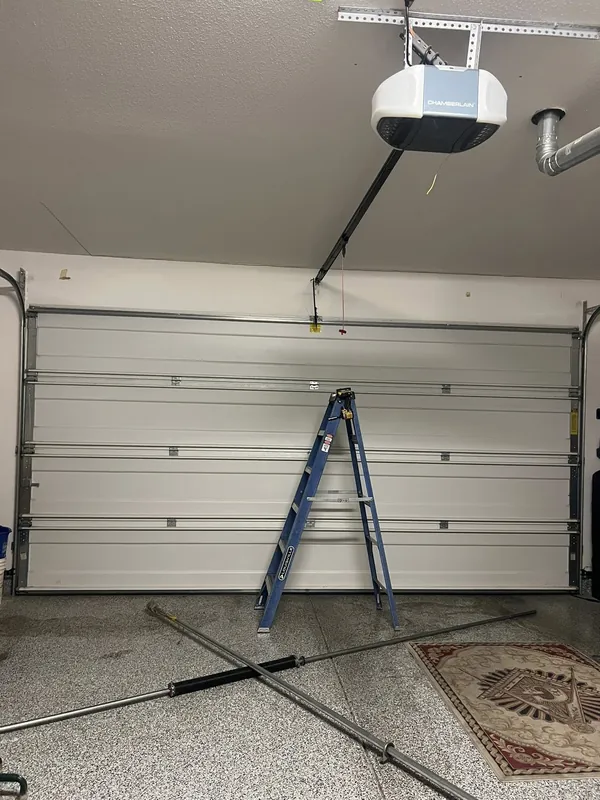 New garage door installation, interior with open ceiling