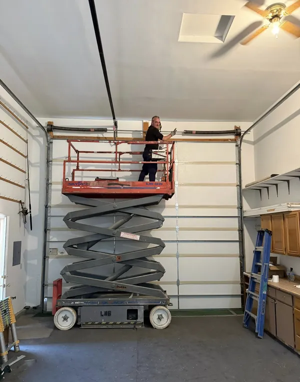 Commercial garage door serviced with lift access