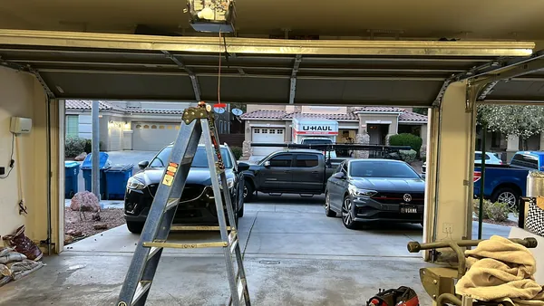 High commercial door reached with a scissor lift