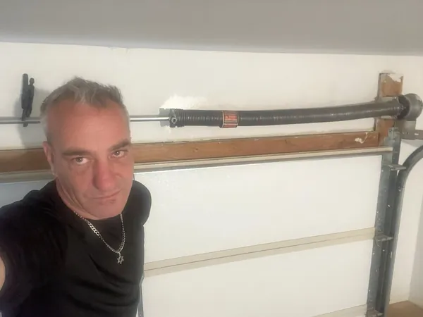 Owner Shay Angel on a garage door job