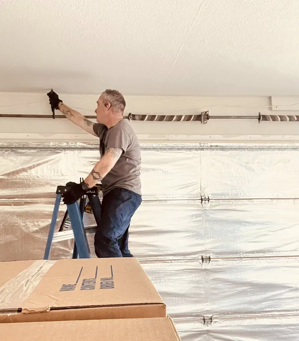 Technician installing a garage door, Las Vegas